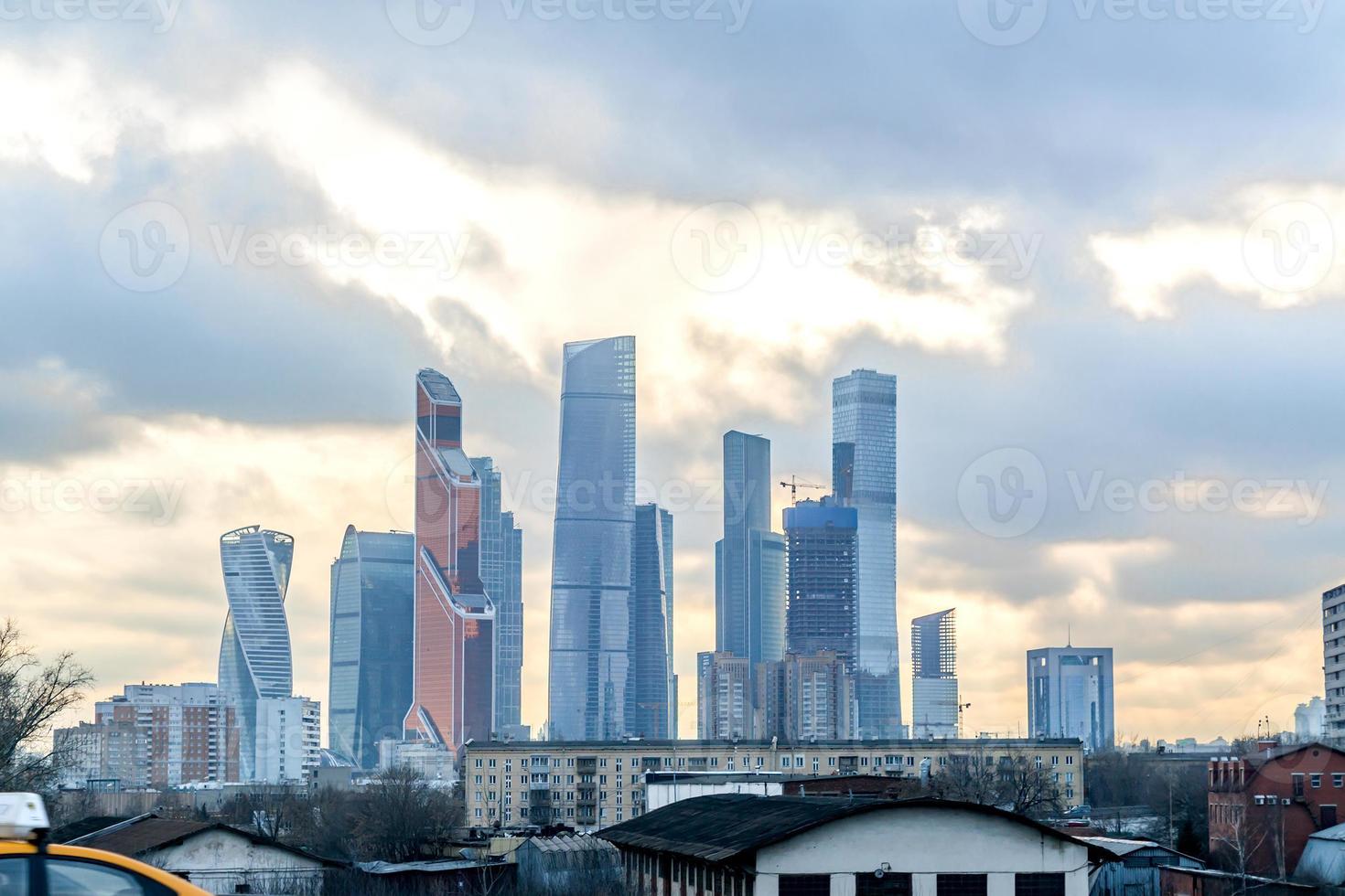 Cityscape view - modern skyscrapers and slum buildings together photo