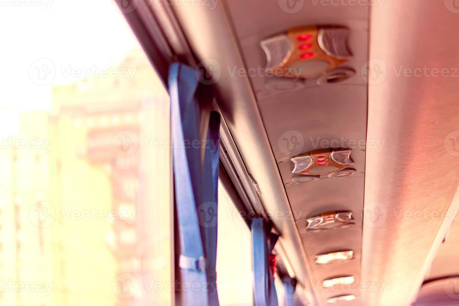 roof of the touristic bus, inside the bus, sunlight through the window photo