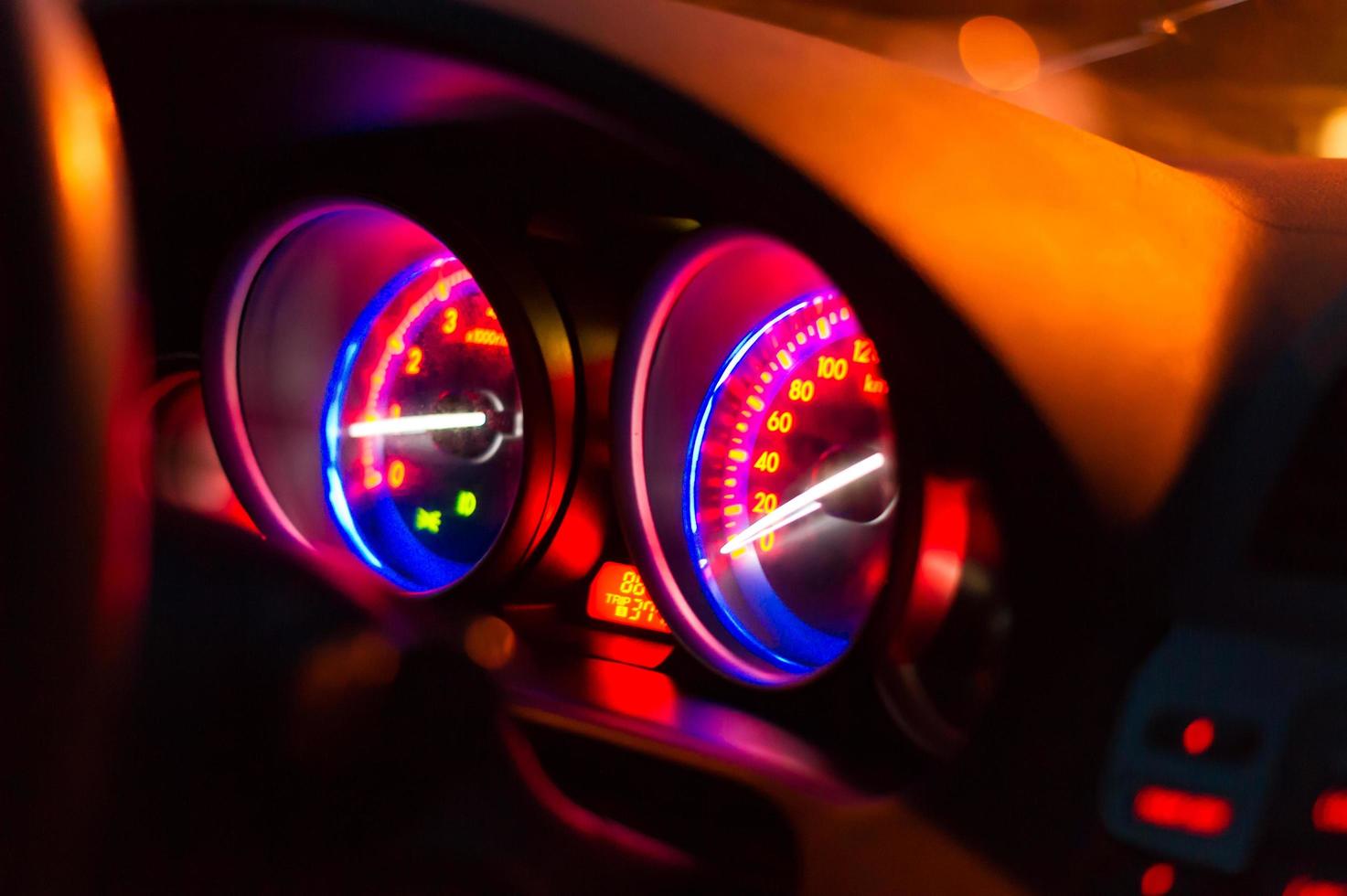 Mile meter console inside car - Led light in dark photo