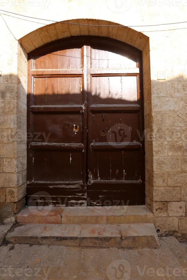 A door is an opening in a wall to enter and exit a building. photo