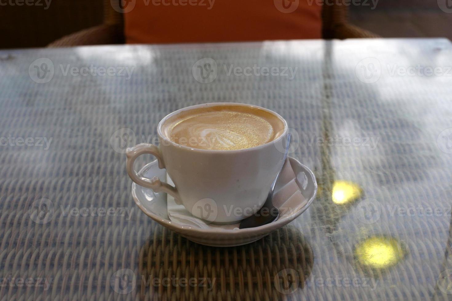 On the table in the restaurant strong and hot coffee. photo