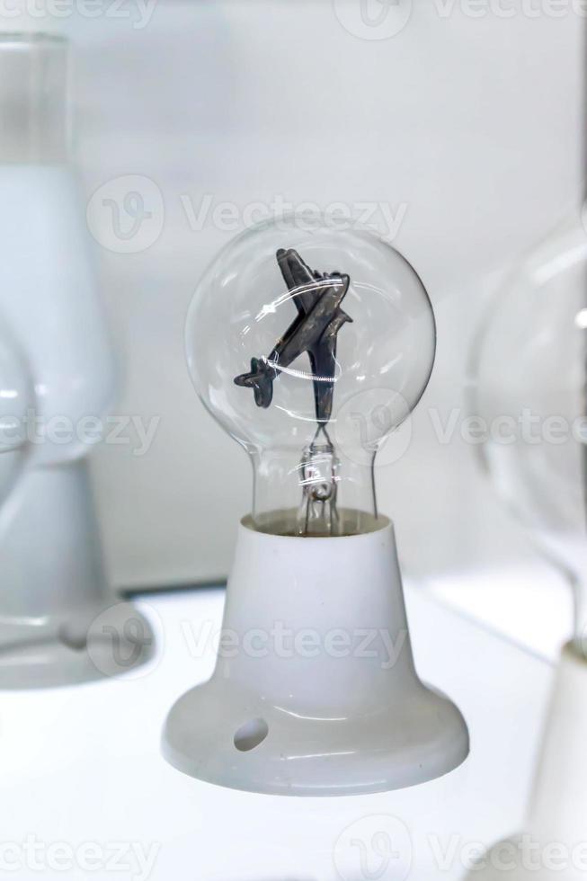 lightbulb on glass shelf 9979780 Stock Photo at Vecteezy