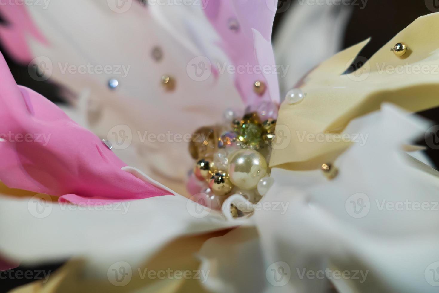 closeup of artificial flower with crystals. Soft focus photo