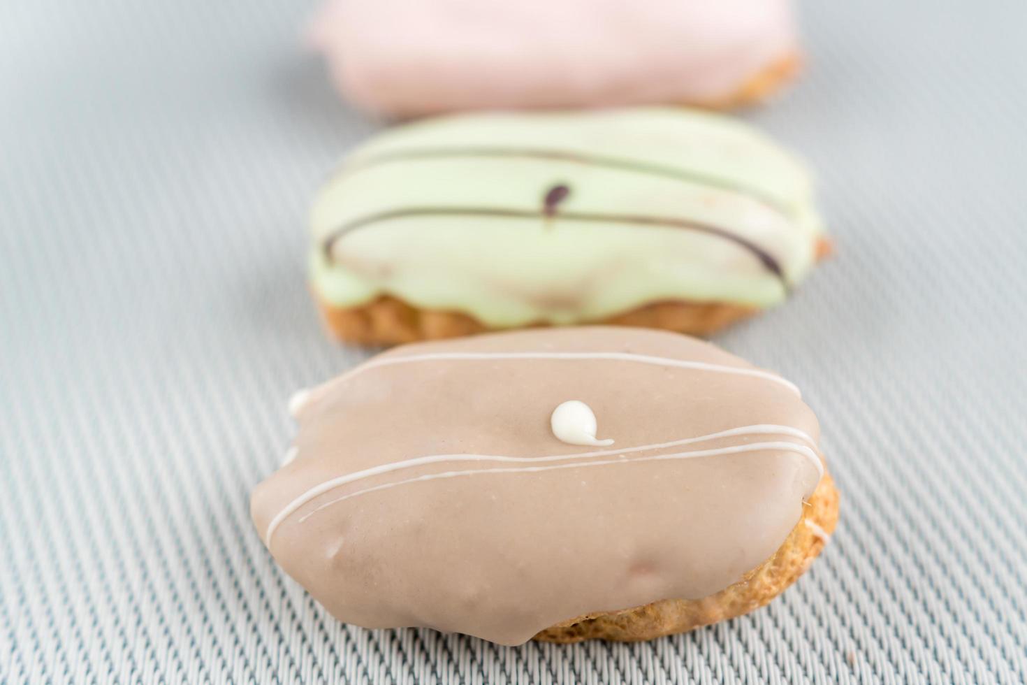 french eclairs on white background photo