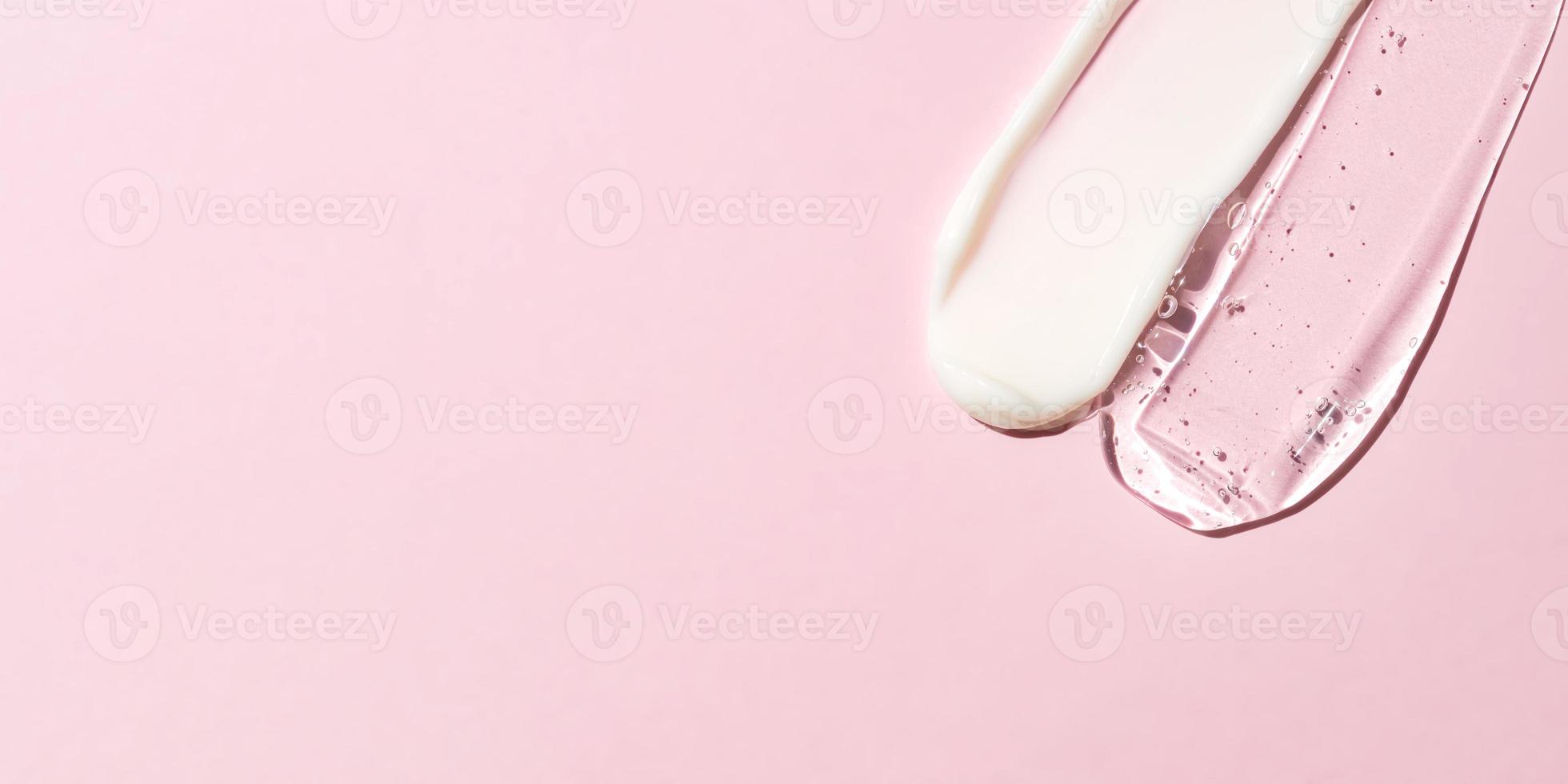 Cream and gel transparent cosmetic sample texture with bubbles on pink background. Skin care products smear with place for text. Banner photo