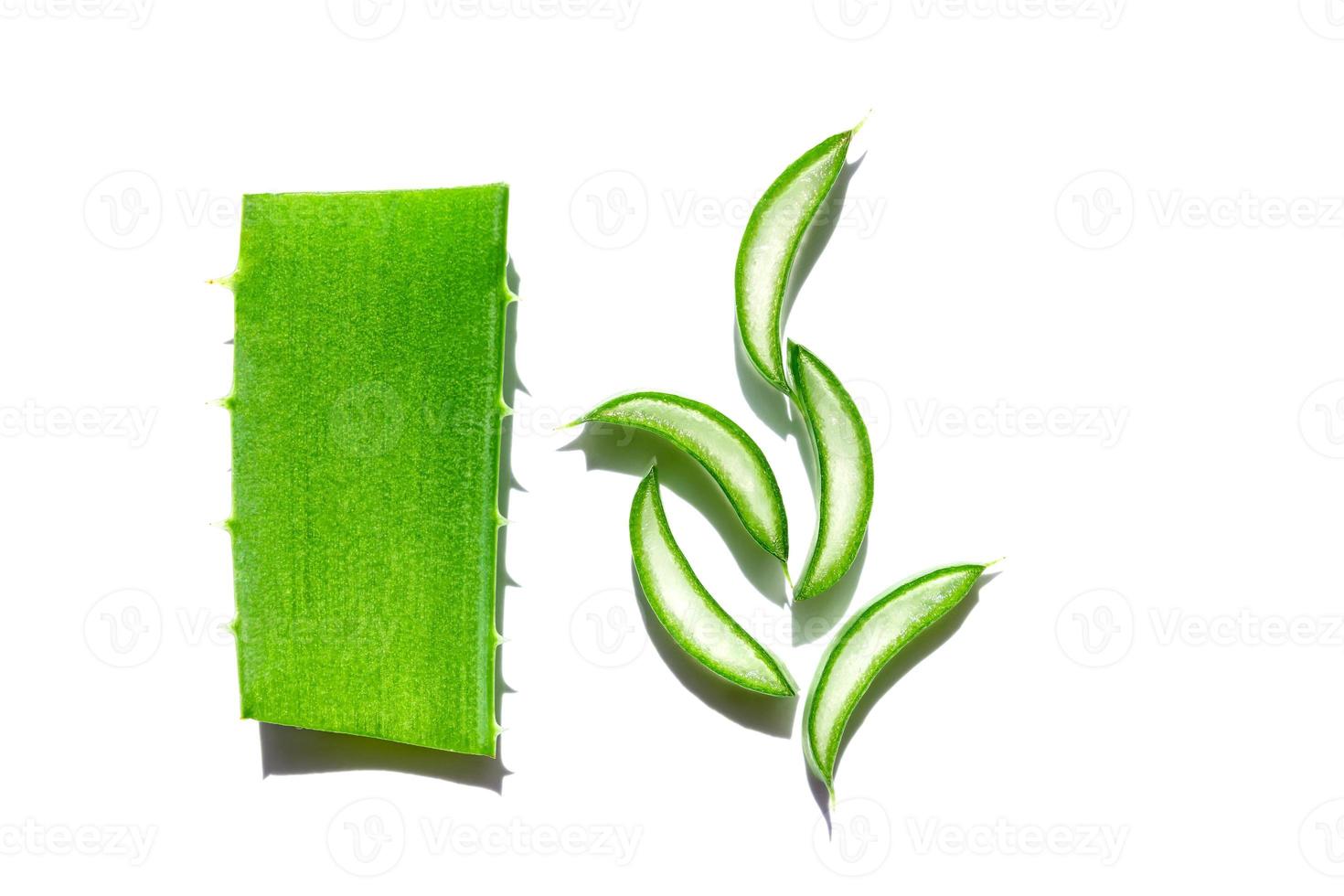 Sliced leaf of aloe vera on white background. Natural organic ingredient for cosmetics. Aloe gel. photo