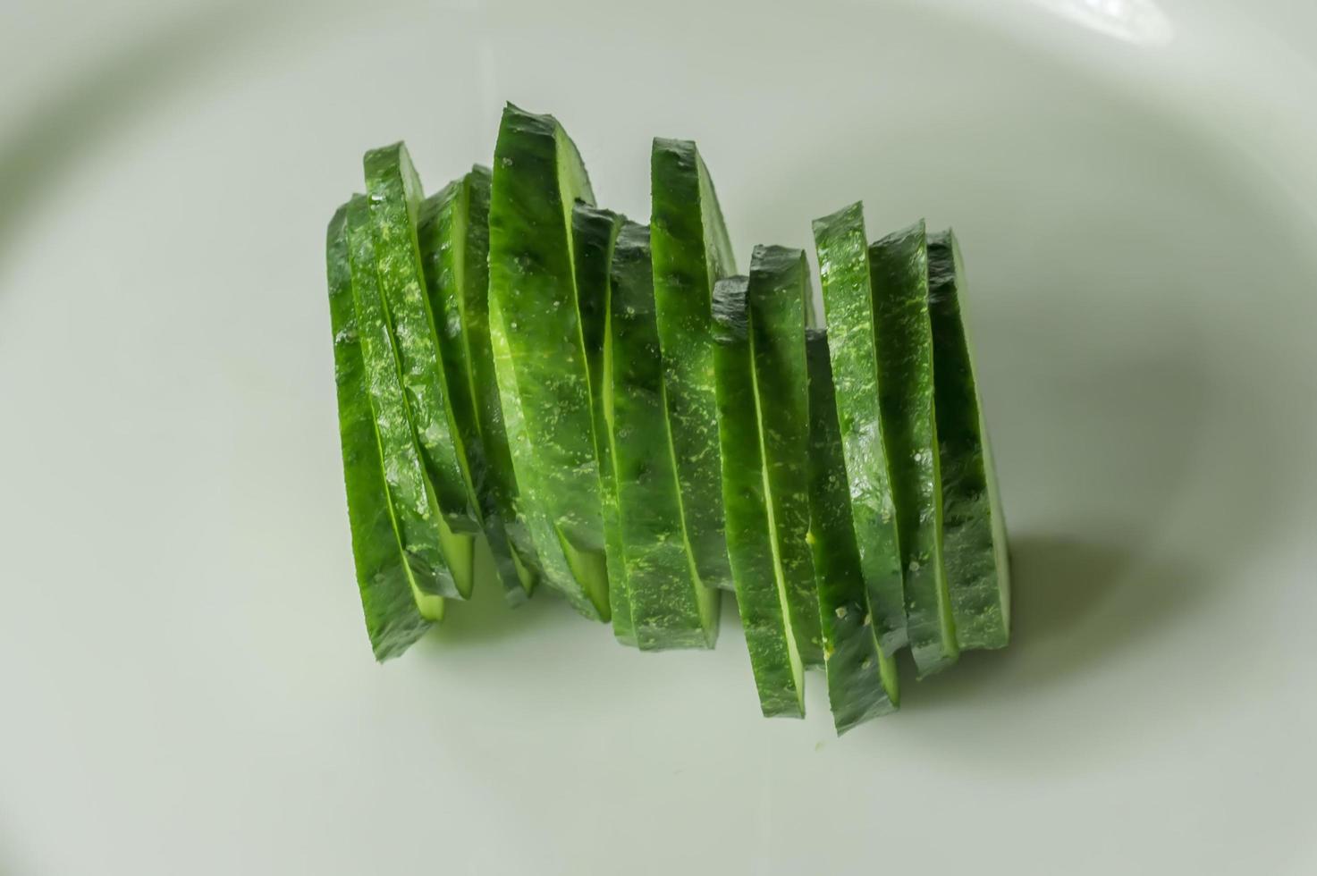 cucumbers on a white plate photo