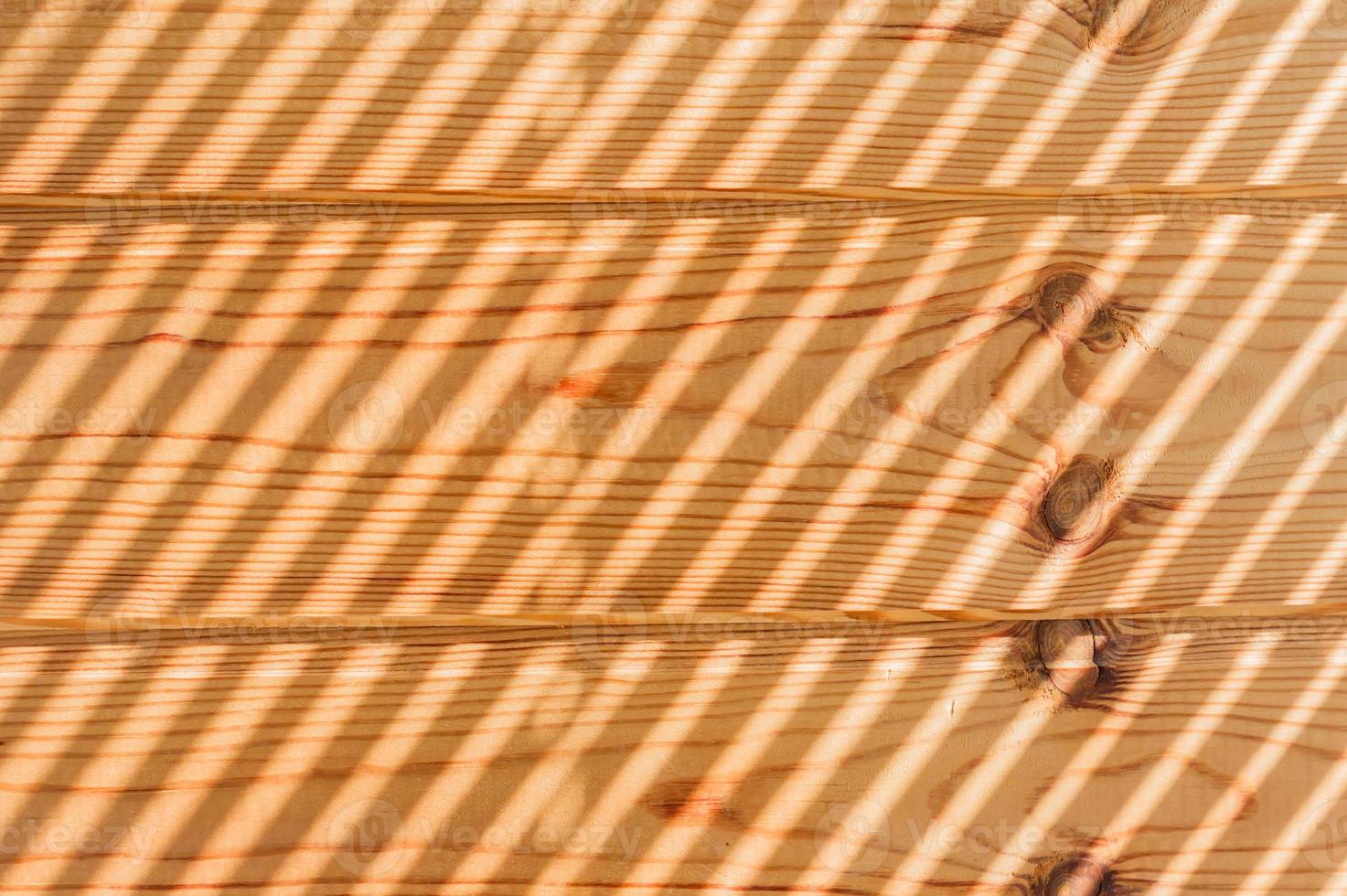 wooden panel background with light shadows photo