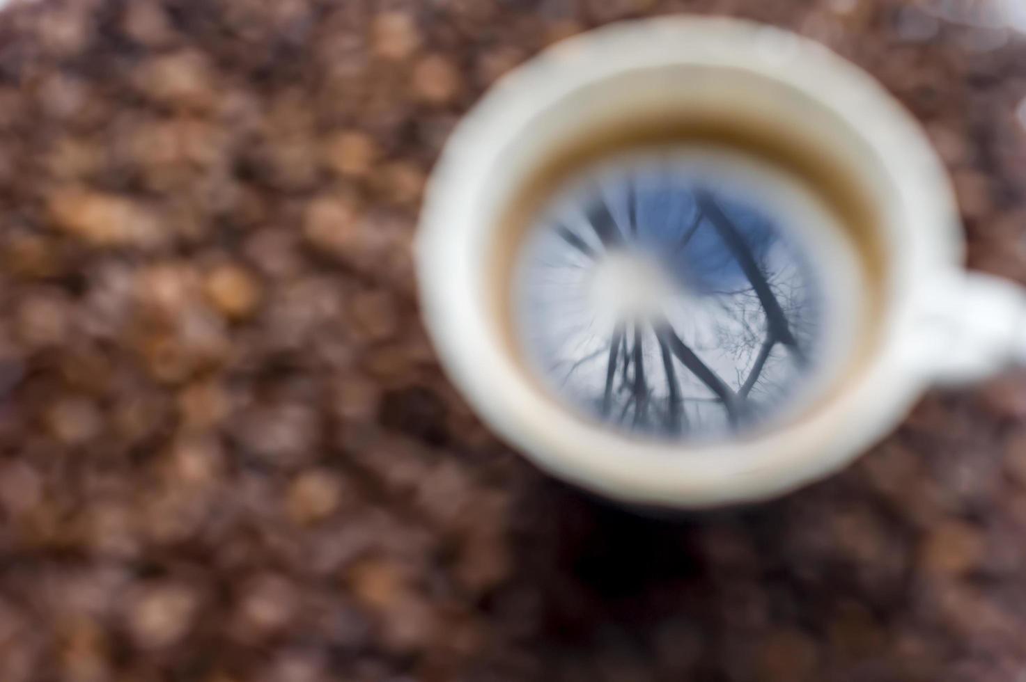 cup of coffee on coffee beans background photo