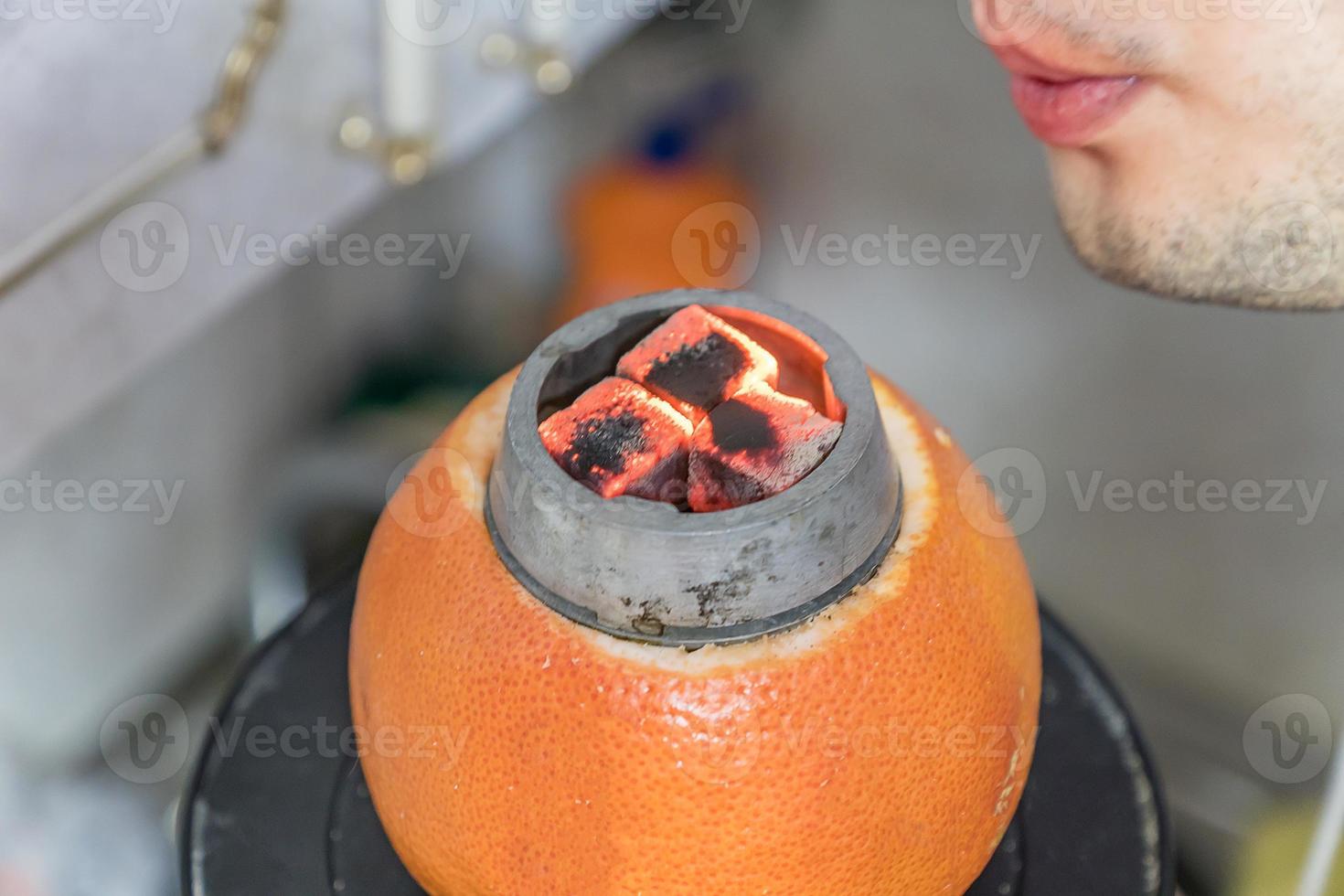 preparation of home made hookah with grapefruit 9984850 Stock Photo at