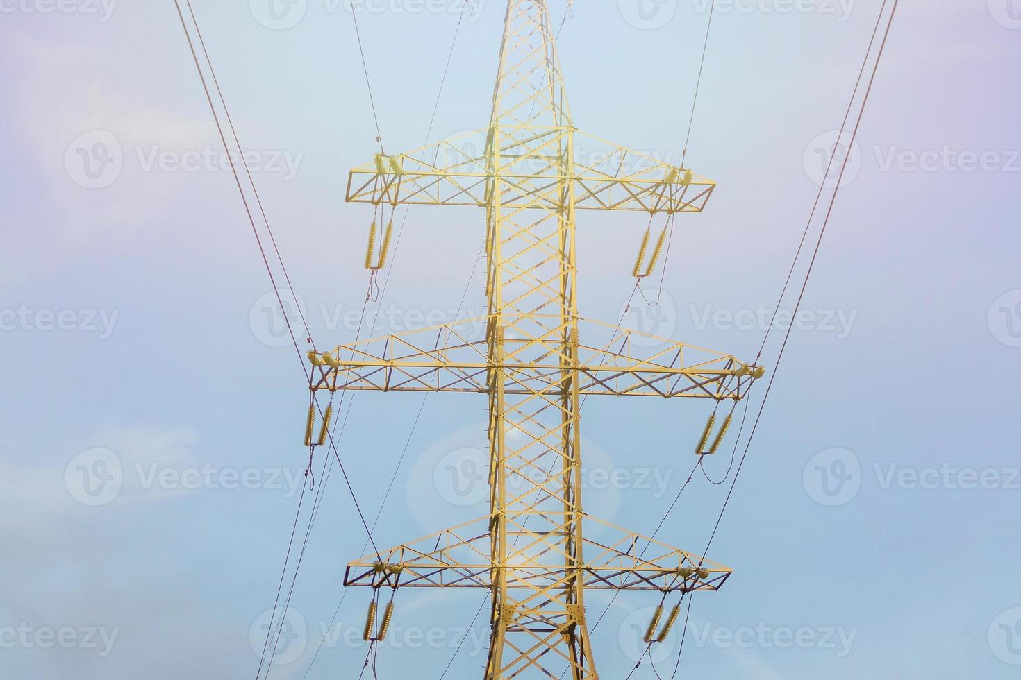 close up of high voltage power line against blue sky photo