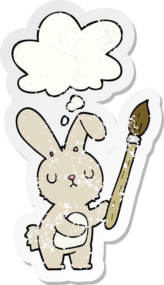 cartoon rabbit with paint brush and thought bubble as a distressed worn sticker vector