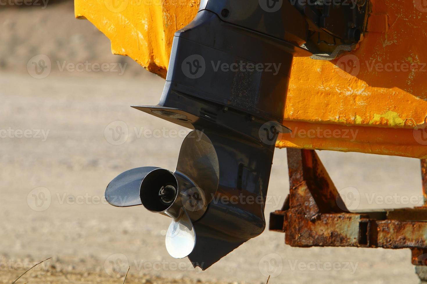 Motor and propeller of a motorboat. photo