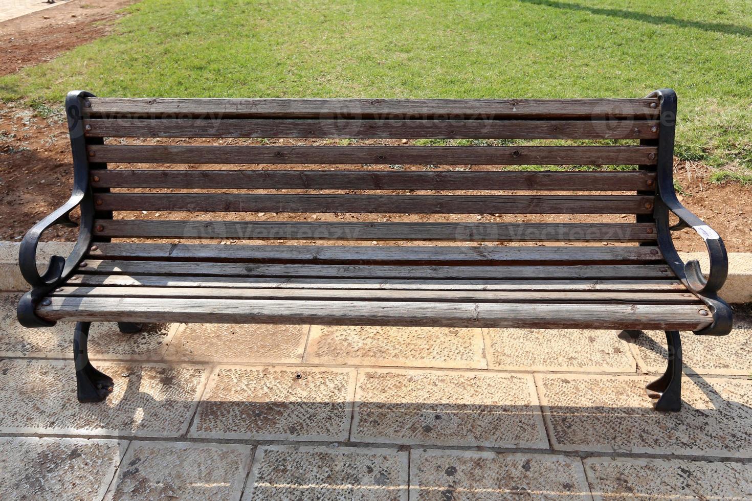 Bench in a city park on the Mediterranean coast photo