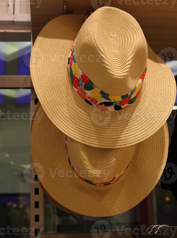 A mannequin stands on a showcase in a large store. photo