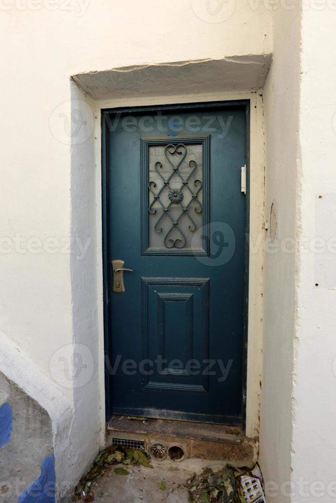 A door is an opening in a wall to enter and exit a building. photo