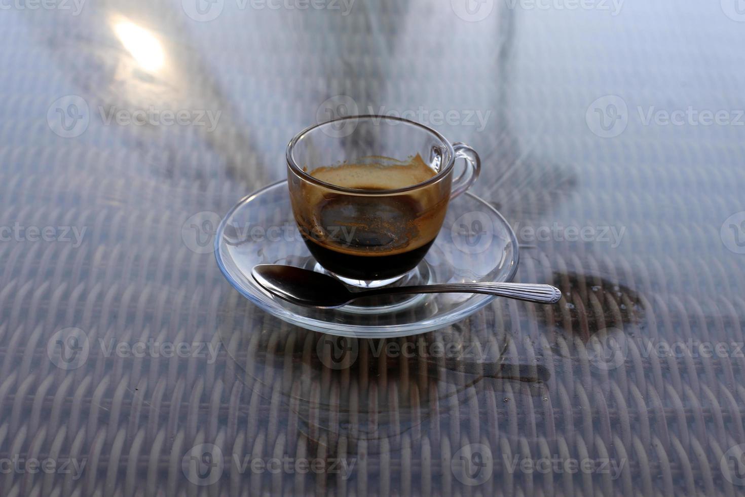 On the table in the restaurant strong and hot coffee. photo