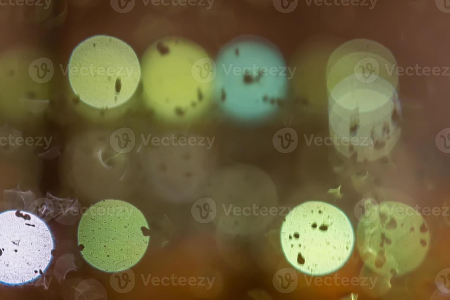 defocused lights through wet car window photo