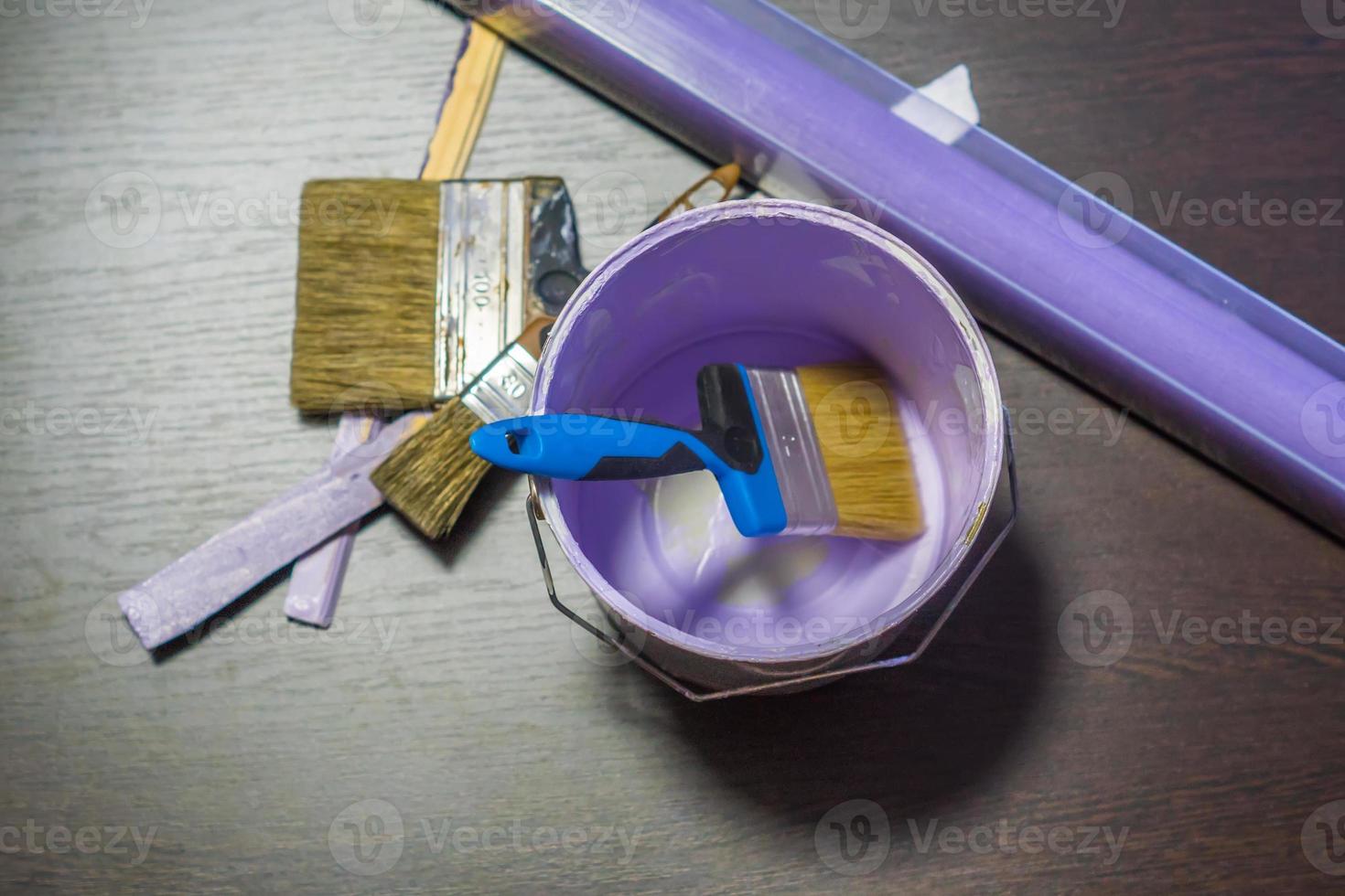 tools for repair and painting on wooden background photo