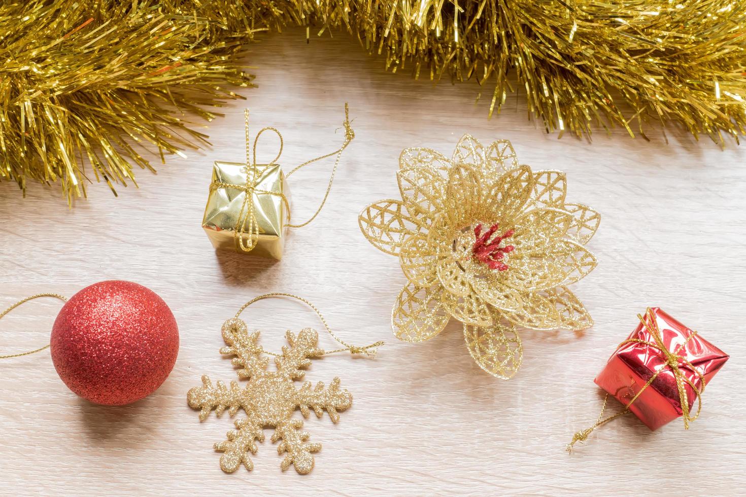 Christmas New Year holiday background. Golden tinsel and christmas tree decoration toys photo