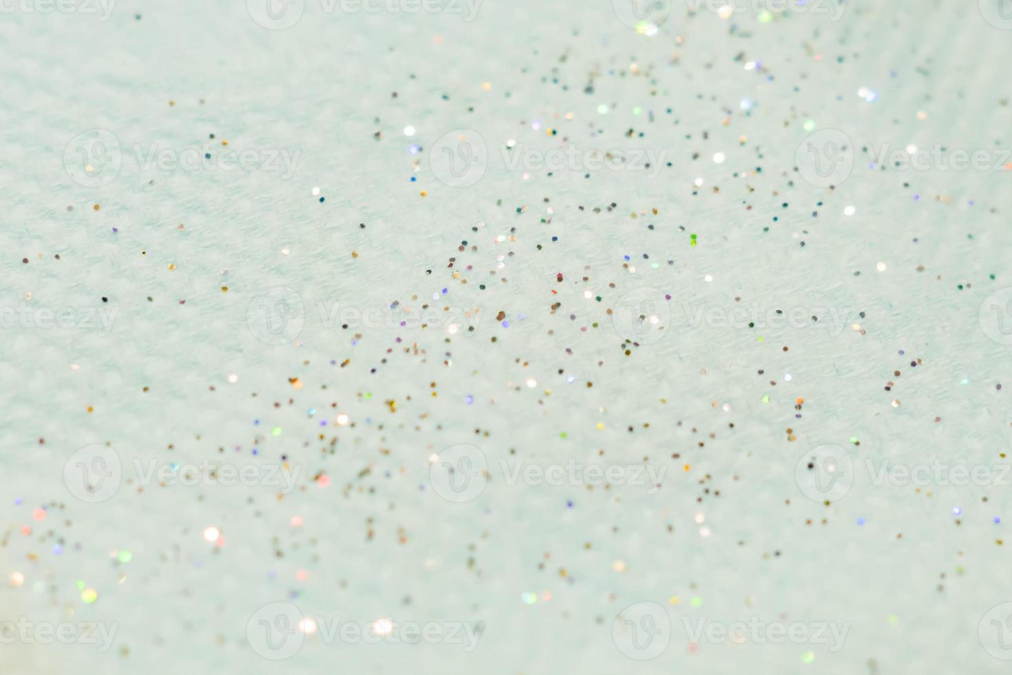 scattered glitter on textured paper photo