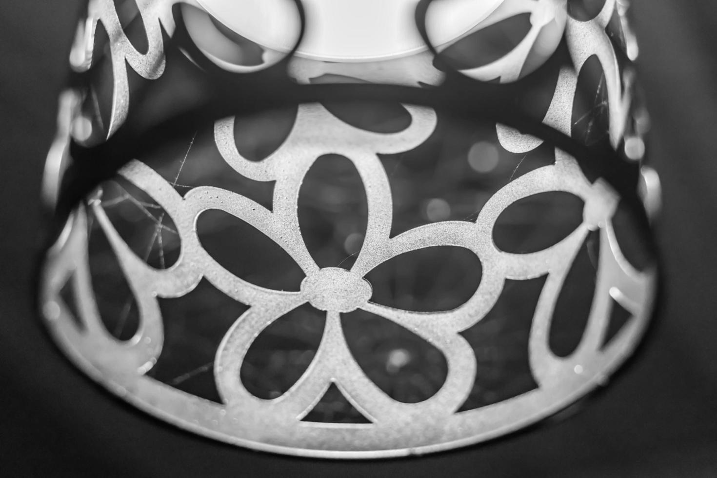 closeup of lamp with spiderweb, grey colors photo