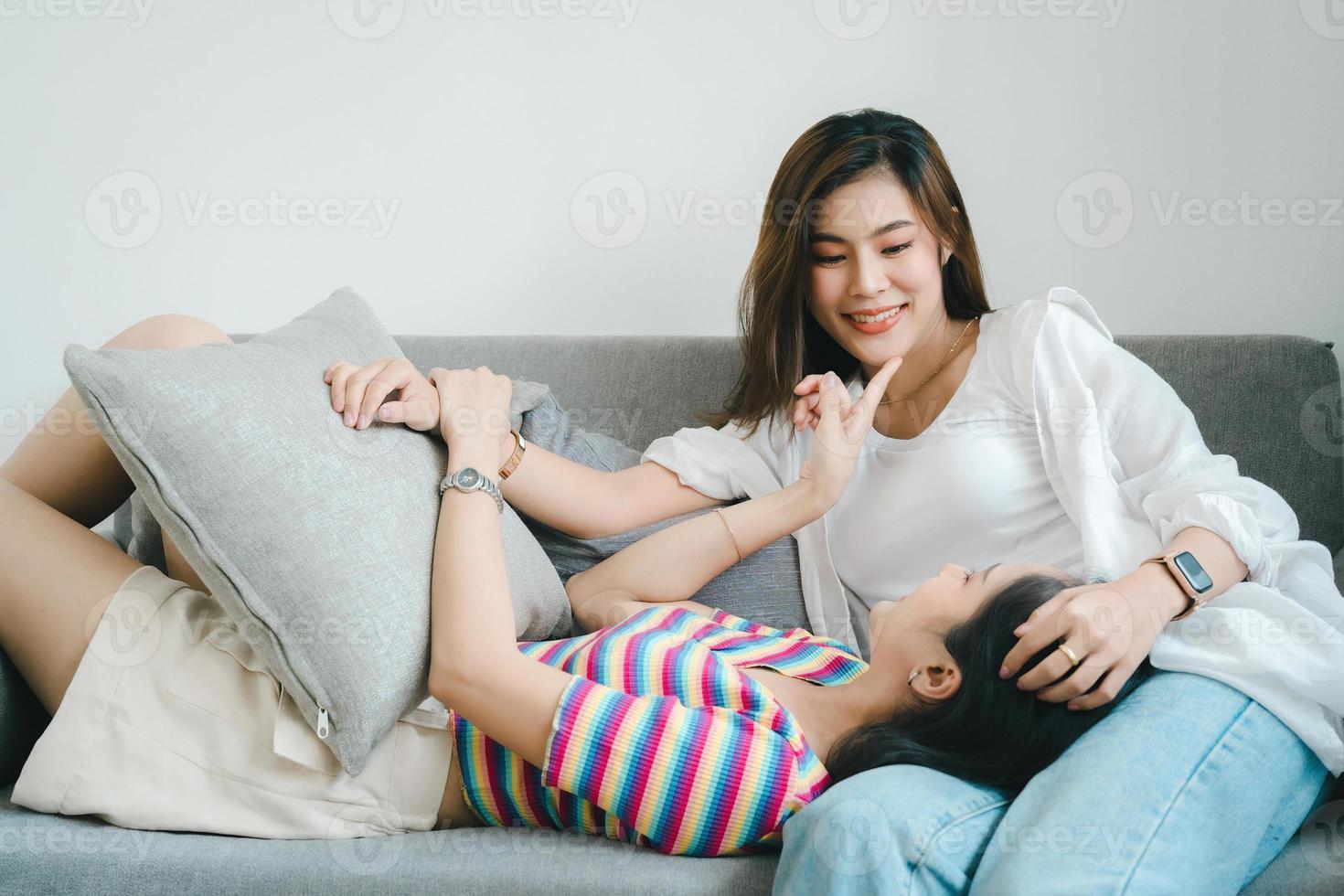 lgbtq, lgbt concept, homosexuality, portrait of two Asian women posing happy together and showing love for each other while being together photo