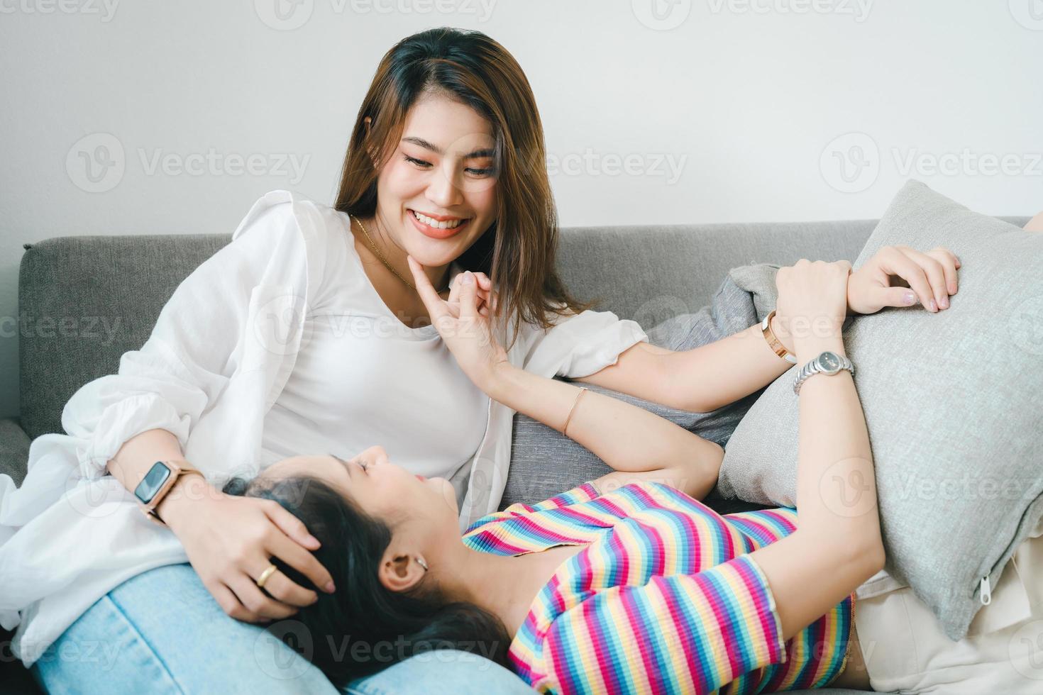 lgbtq, lgbt concept, homosexuality, portrait of two Asian women posing happy together and showing love for each other while being together photo