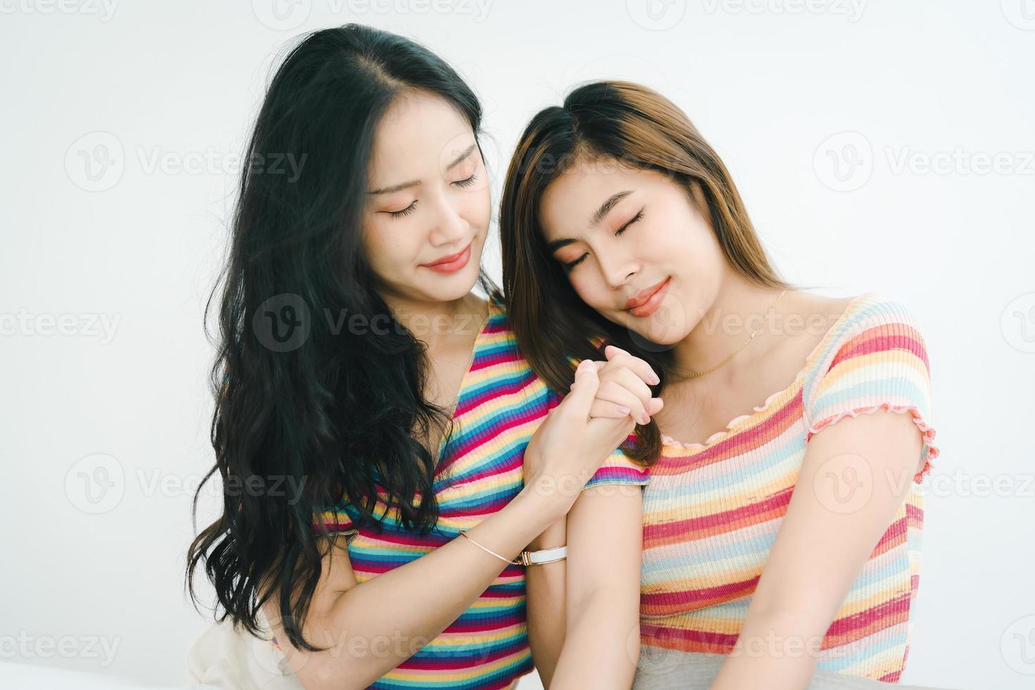 lgbtq, lgbt concept, homosexuality, portrait of two Asian women posing happy together and showing love for each other while being together photo