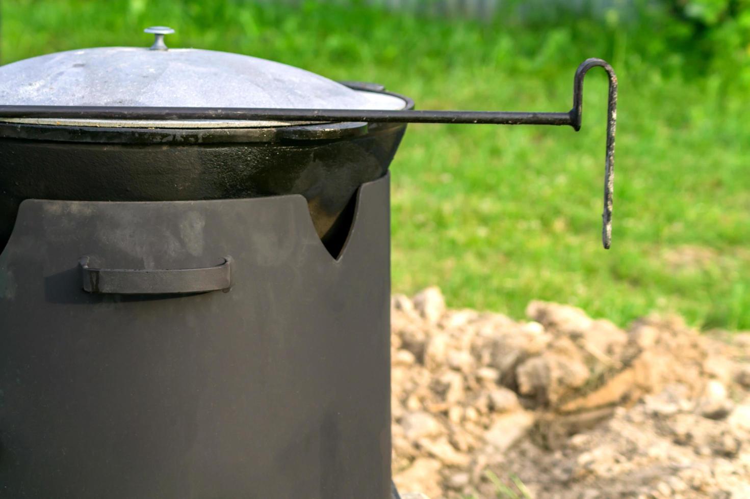 bbq camp oven outdoors for cooking food photo