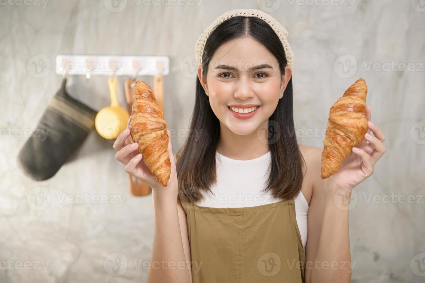 Young beautiful woman is baking in her kitchen , bakery and coffee shop business photo