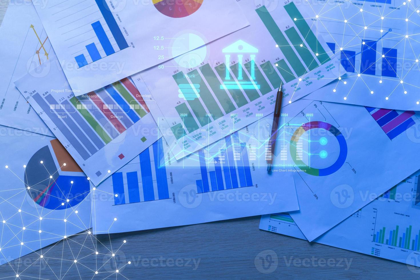 Background of documents with analytics data lying on table photo