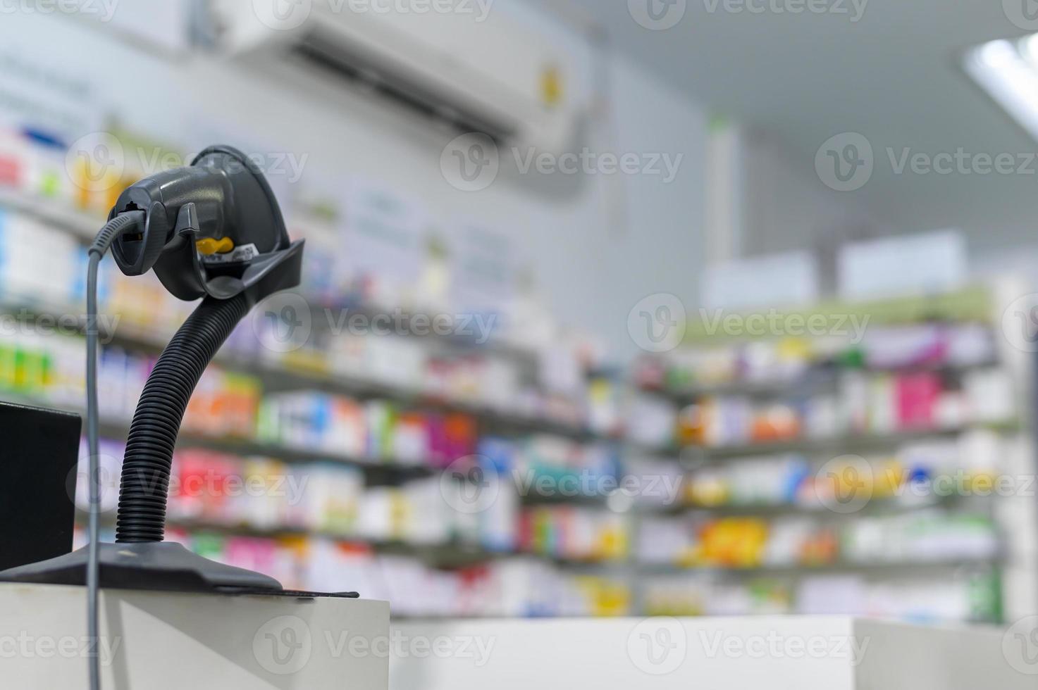 Background of scanning barcode on a medicine box in a modern pharmacy drugstore. photo