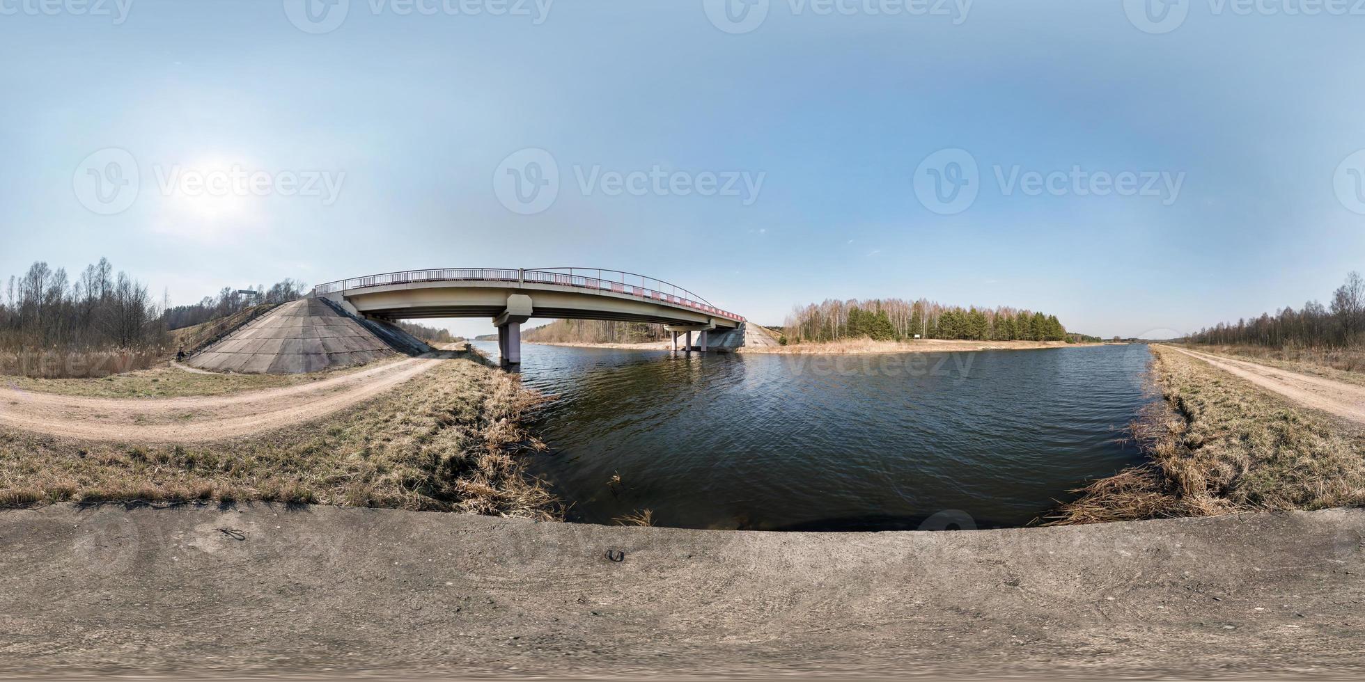 full seamless spherical hdri panorama 360 degrees angle view bridge on the river in sunny day. background in equirectangular equidistant projection for VR AR content photo