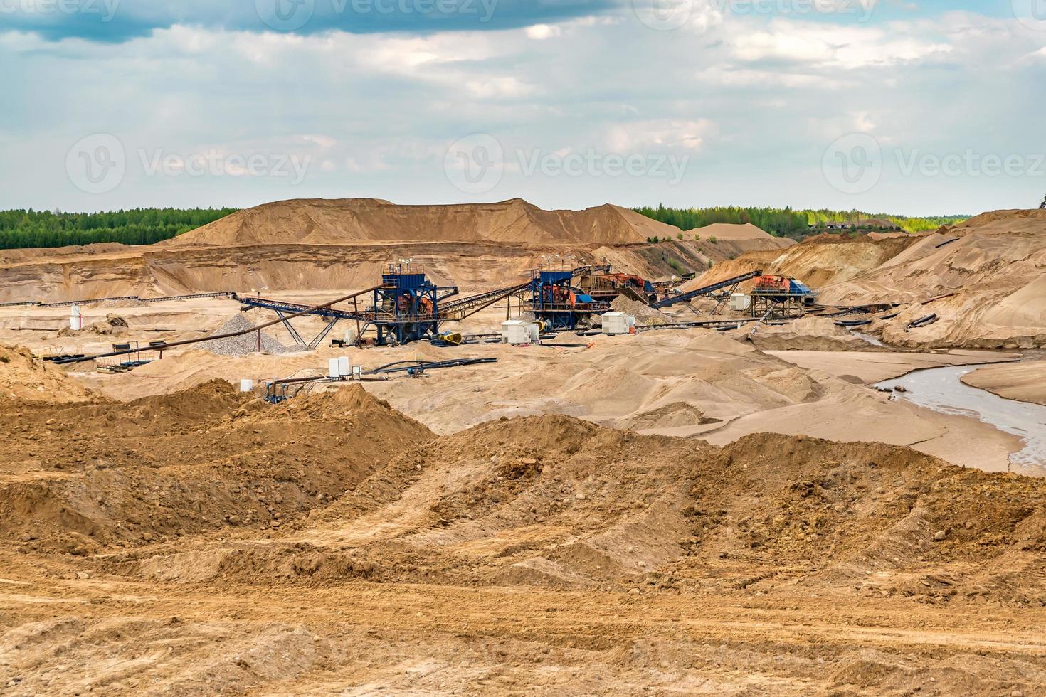 huge digger in quarry  for sand extraction mining photo