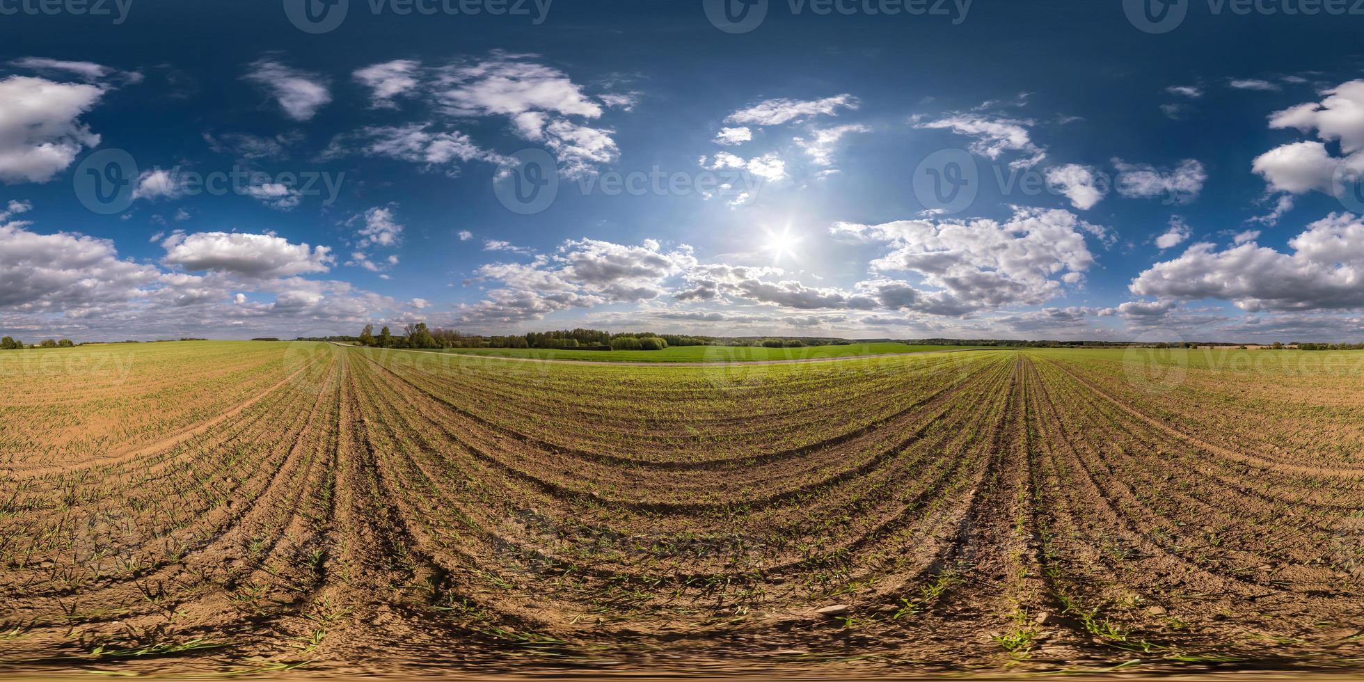 full seamless spherical hdri panorama 360 degrees angle view on among fields in spring day with awesome clouds in equirectangular projection, ready for VR AR virtual reality content photo