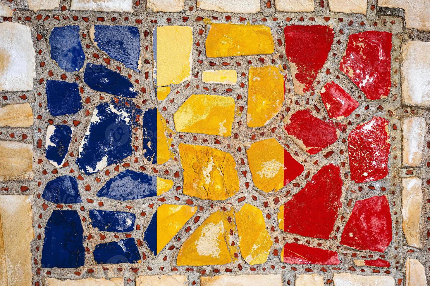 National flag of  Romania on stone  wall background. Flag  banner on  stone texture background. photo