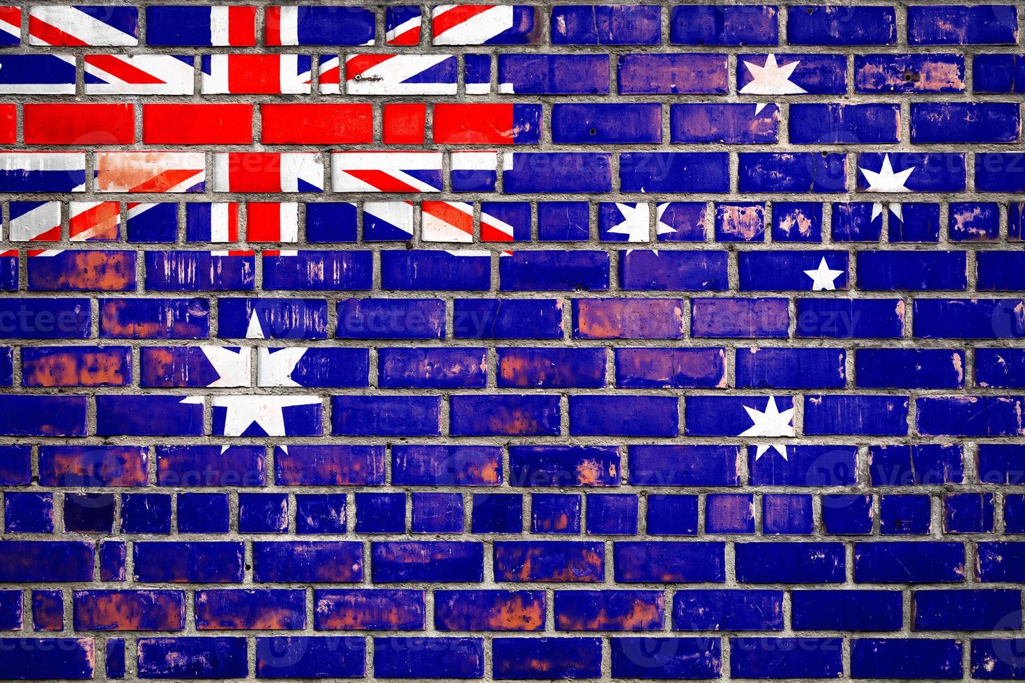 National  flag of the New Zealand on a grunge brick background. photo