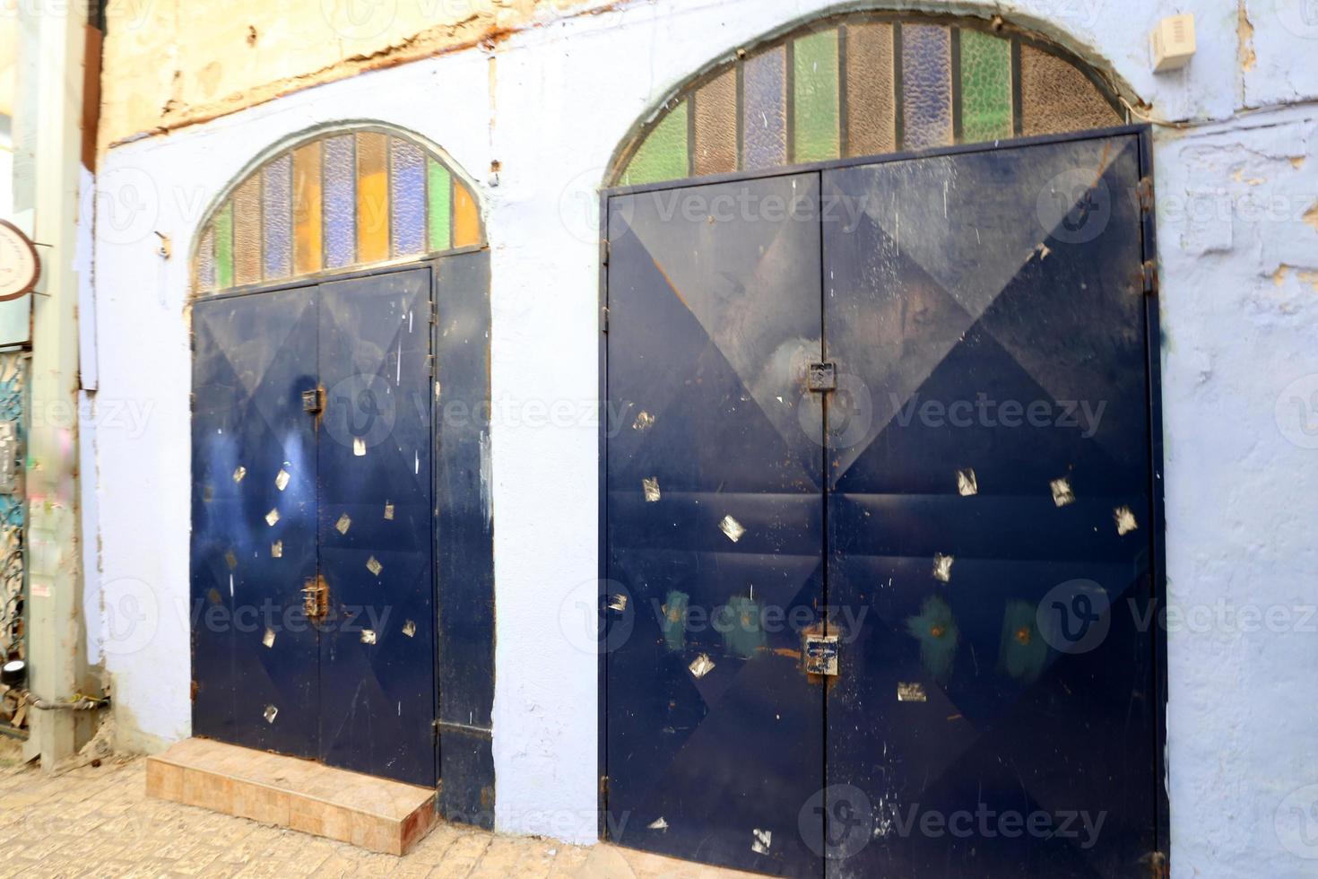 A door is an opening in a wall to enter and exit a building. photo
