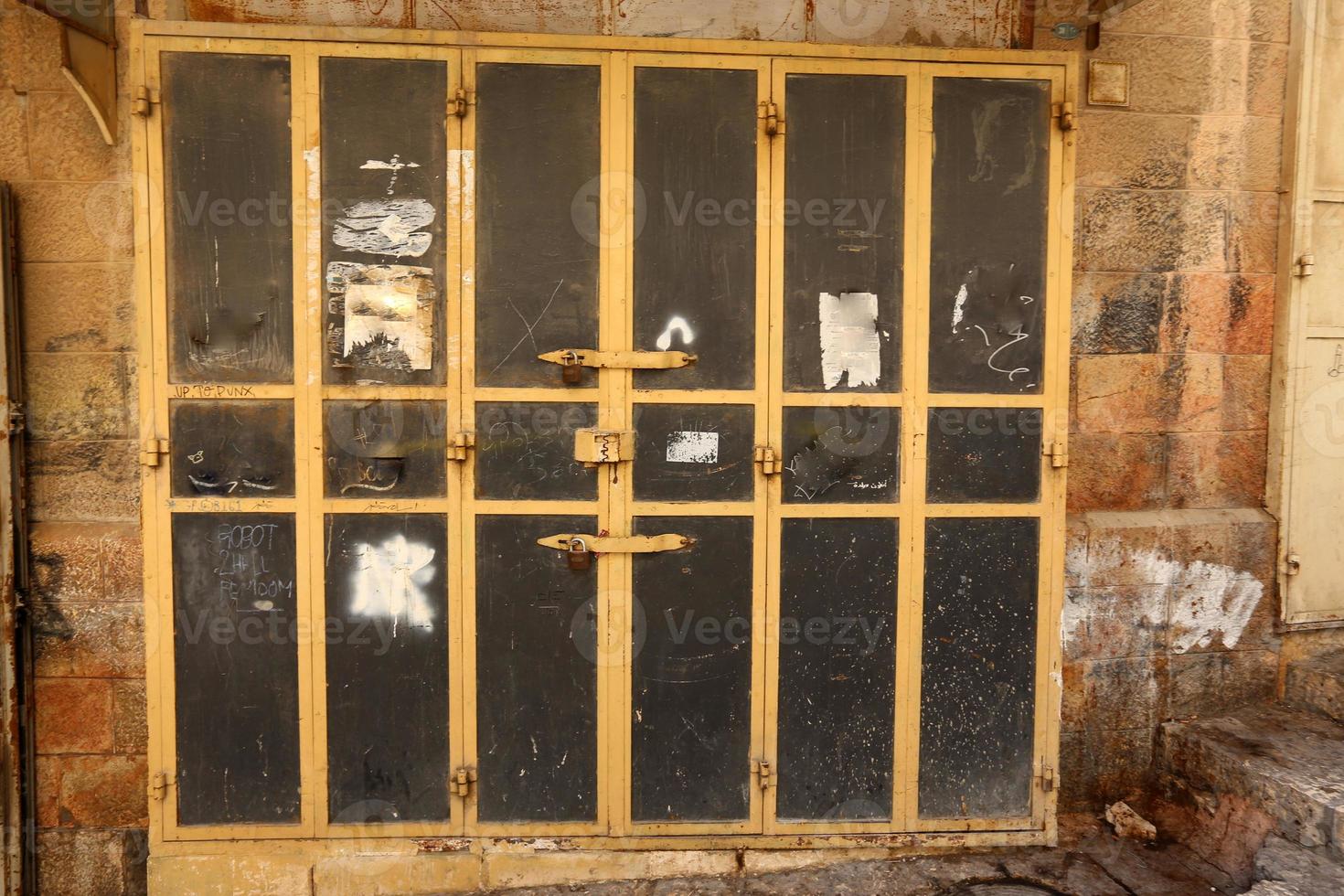A door is an opening in a wall to enter and exit a building. photo