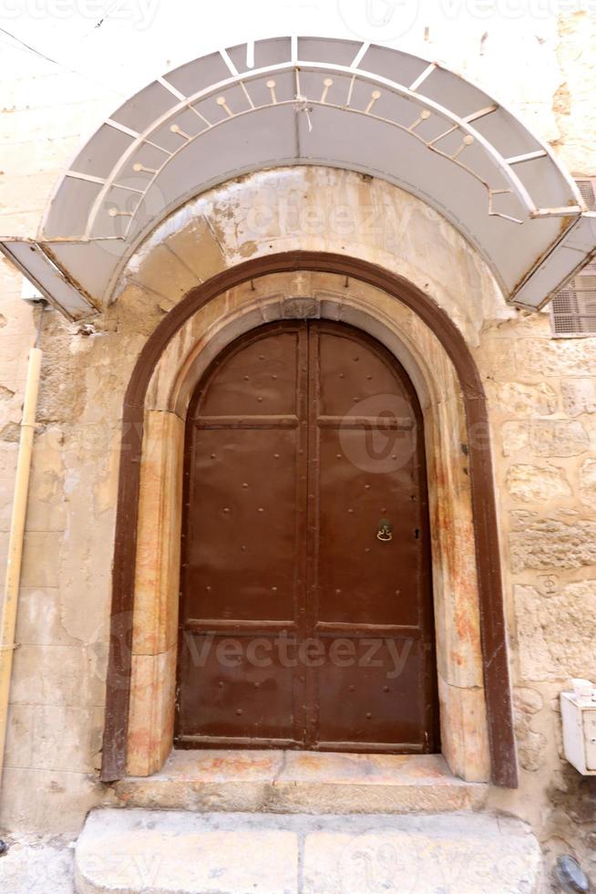 A door is an opening in a wall to enter and exit a building. photo