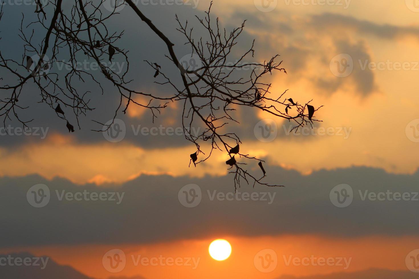 Sunrise at the Dead Sea in Israel. The sun comes out from behind the mountains in Jordan. photo