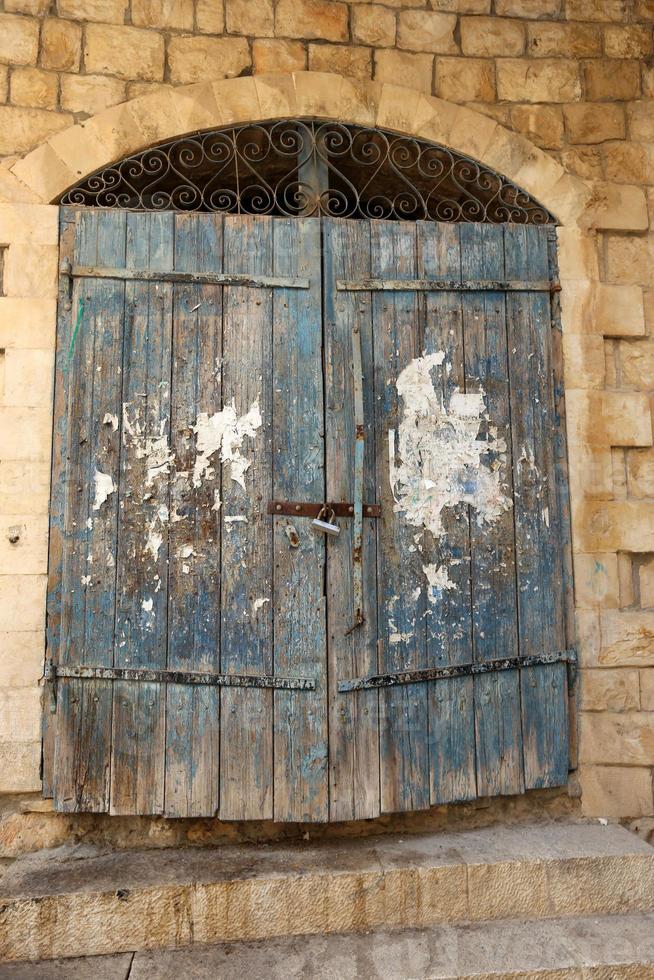 A door is an opening in a wall to enter and exit a building. photo