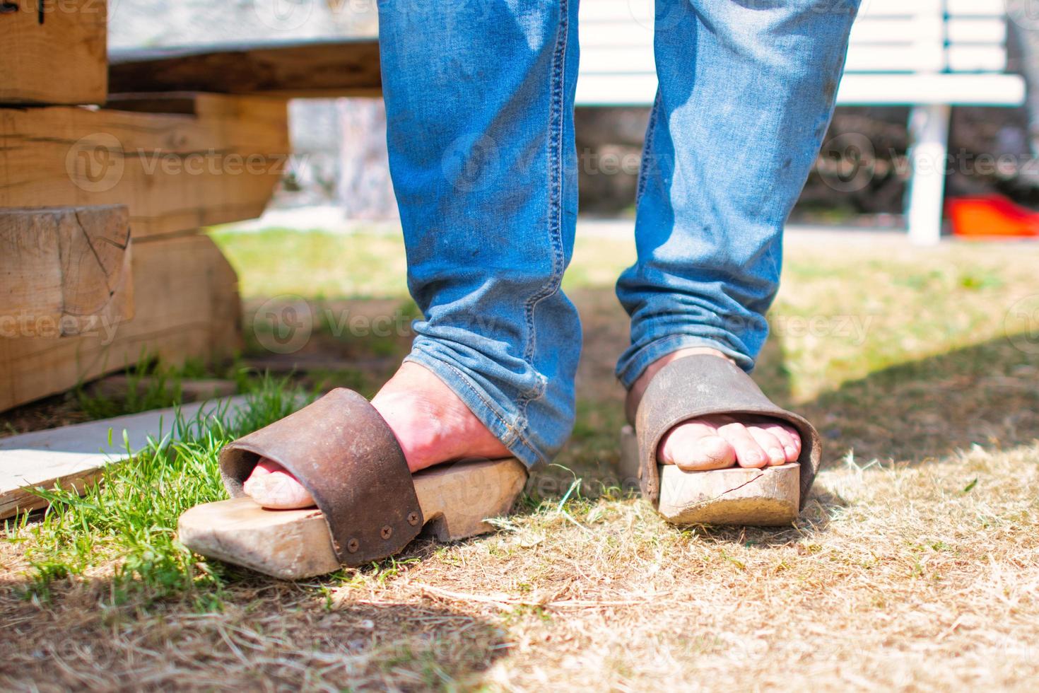 Wooden and leather clogs photo