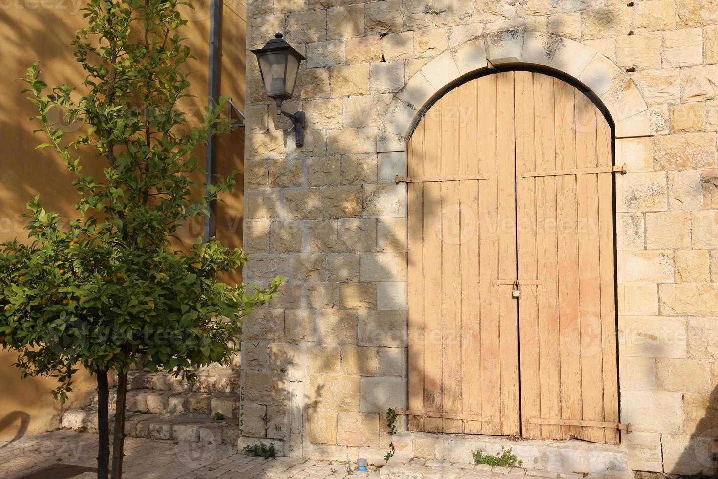 A door is an opening in a wall to enter and exit a building. photo