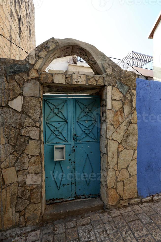 A door is an opening in a wall to enter and exit a building. photo