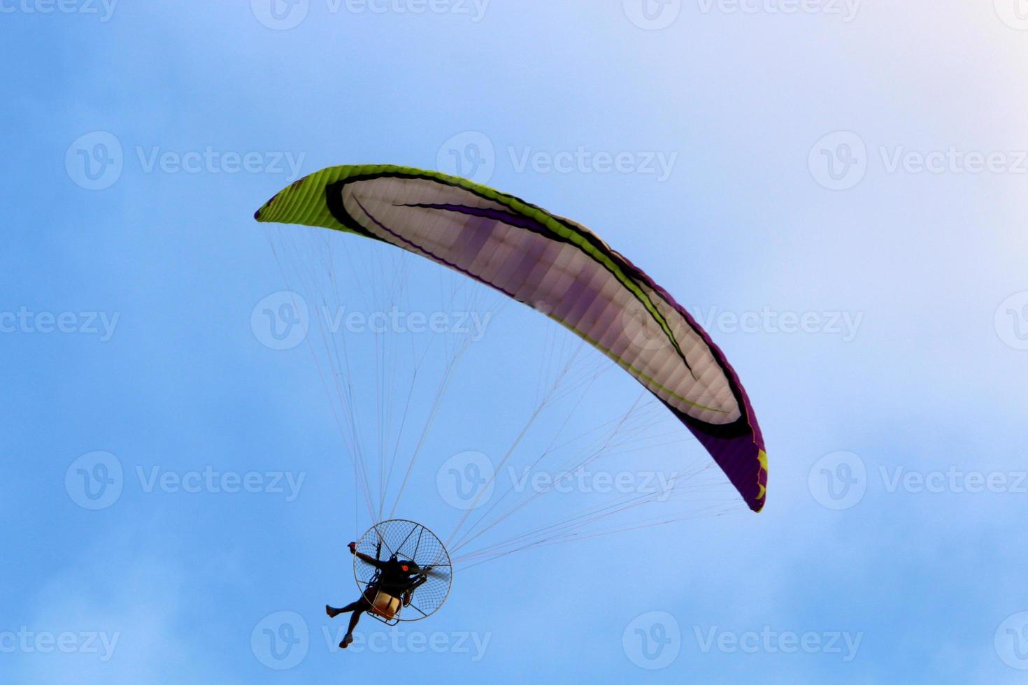 Paragliding in the sky over the Mediterranean Sea. photo