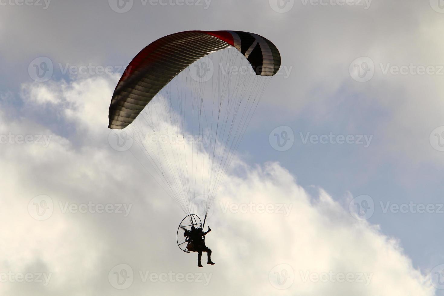Paragliding in the sky over the Mediterranean Sea. photo