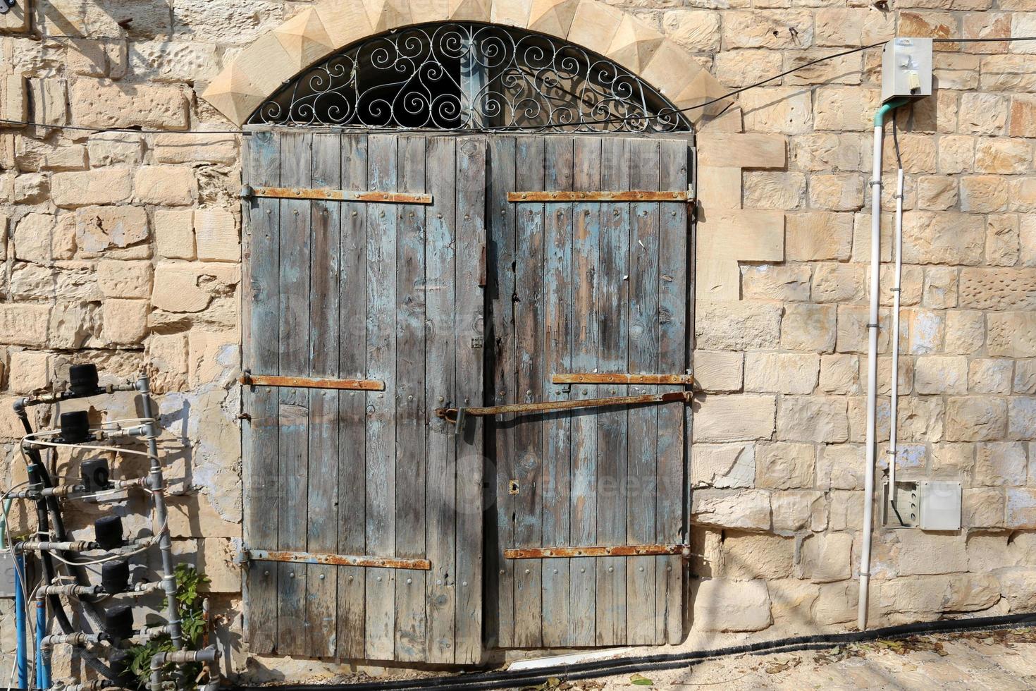 A door is an opening in a wall to enter and exit a building. photo