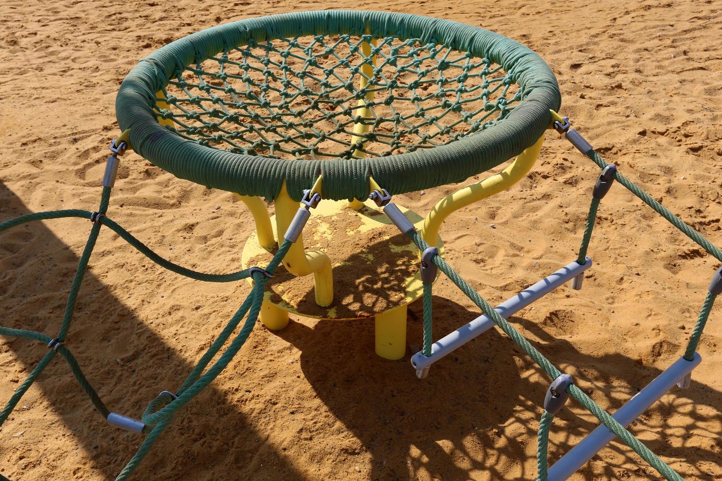 Toys and sports equipment on a playground in Israel. photo